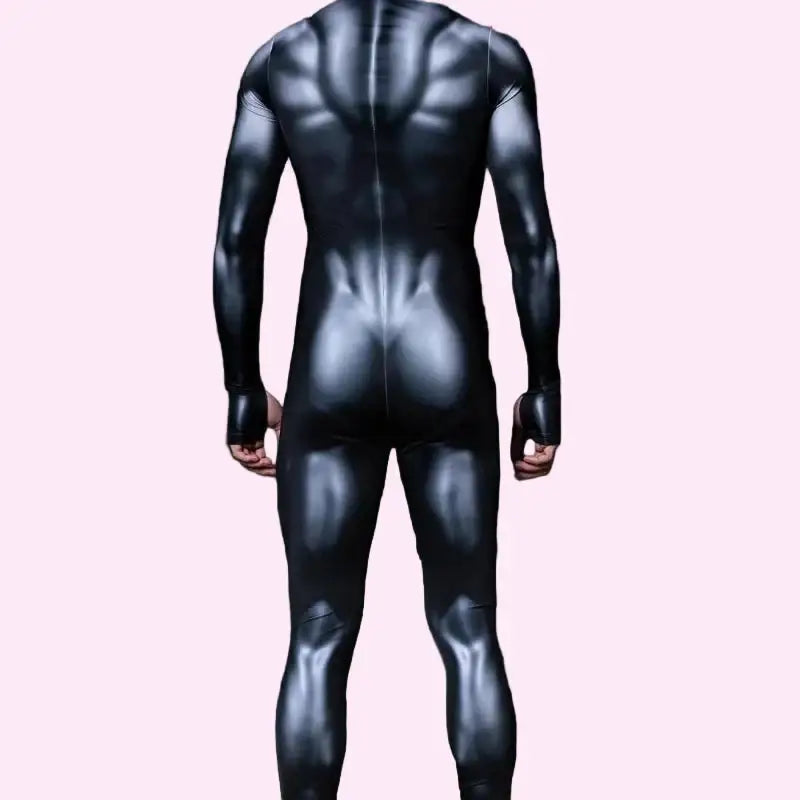 Person wearing a black bodysuit with a dark background