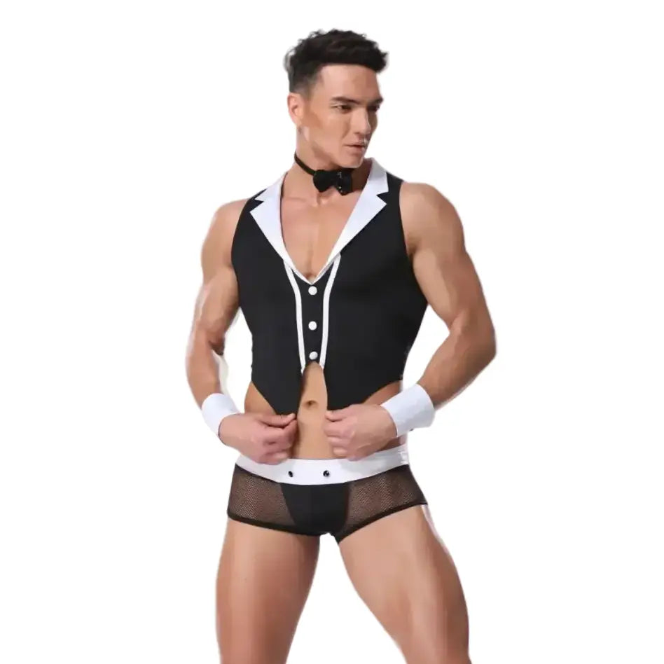 Man wearing a black and white outfit with a pink background