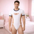 Man wearing a white bodysuit with navy accents in a bedroom setting